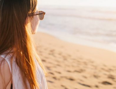 girl-looking-at-beach-med-32437437